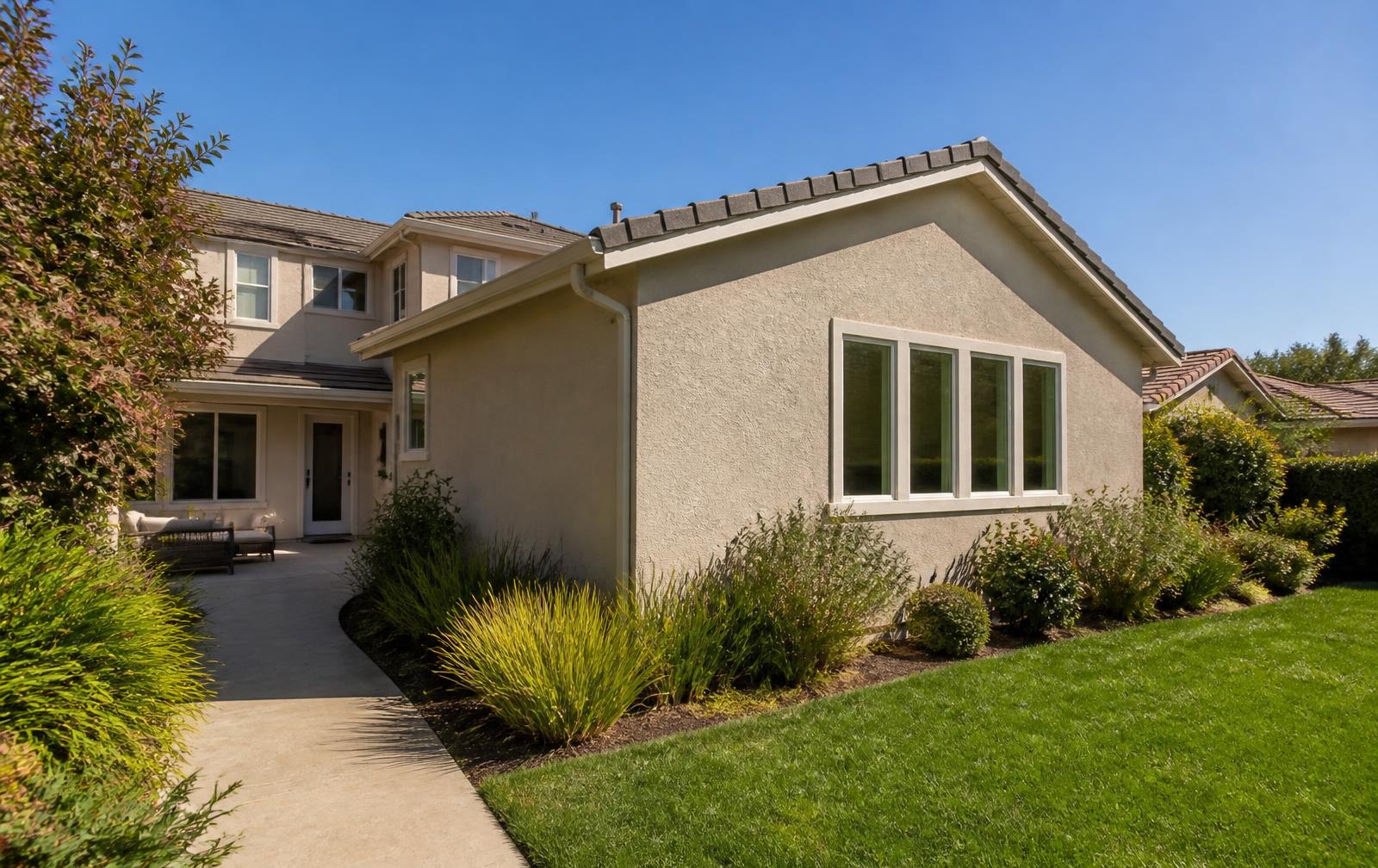 Single-story Walnut Creek home with a completed room addition, new stucco, windows and front landscaping